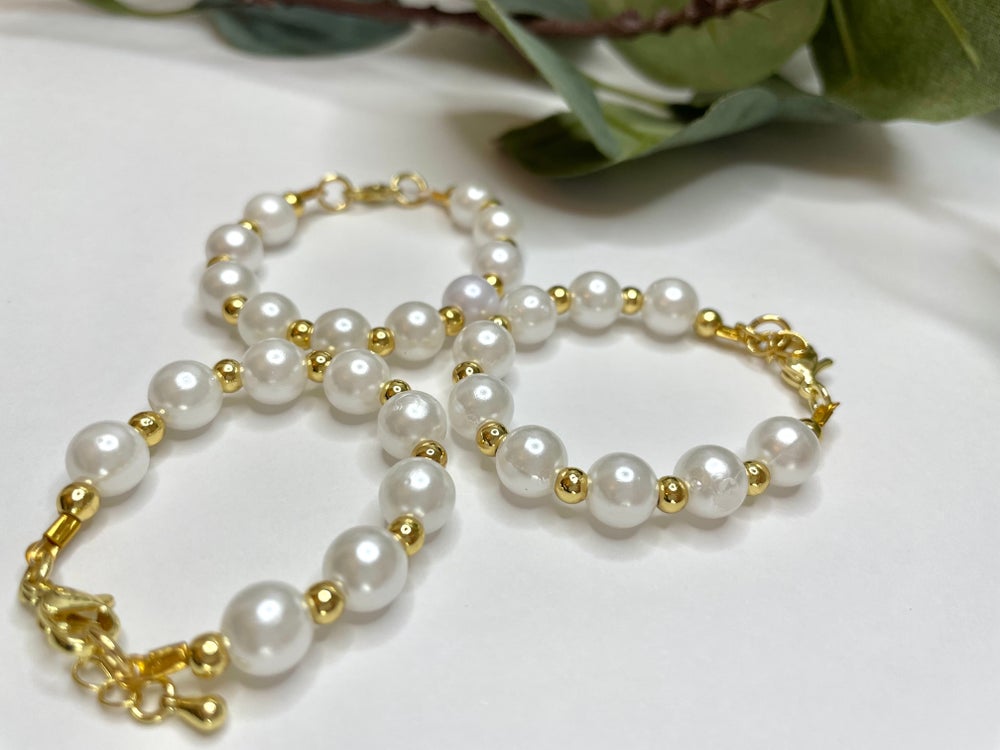 Perla con oro