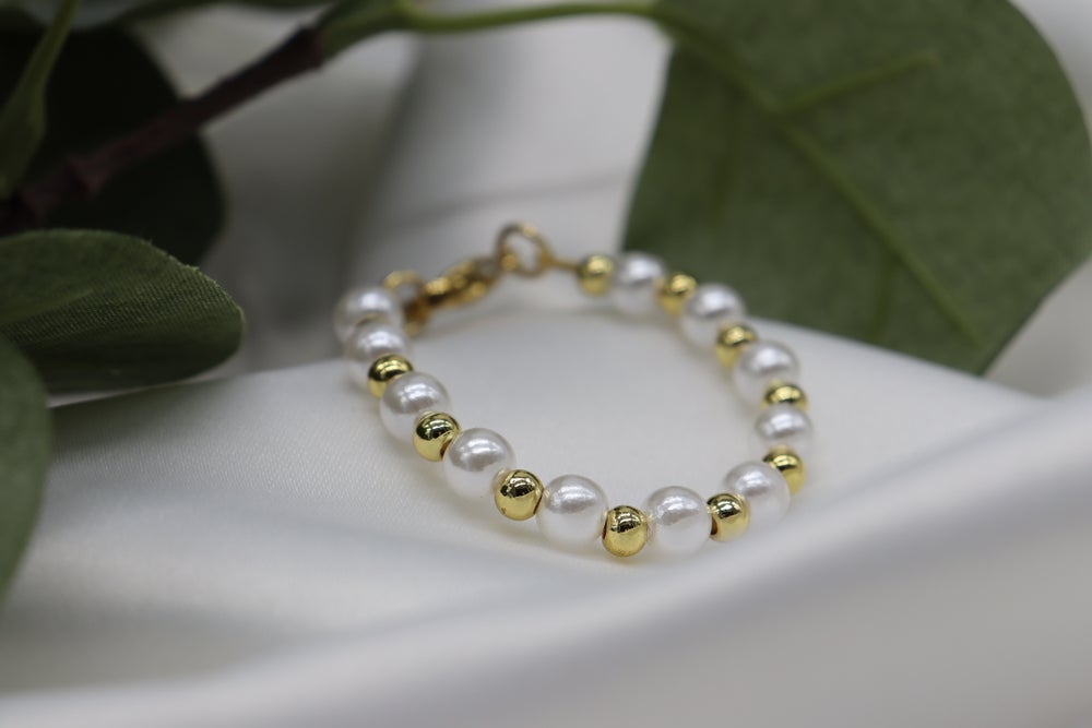 Perla con oro